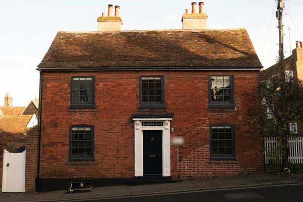 AI visualisation: the same house with anthracite uPVC casement windows