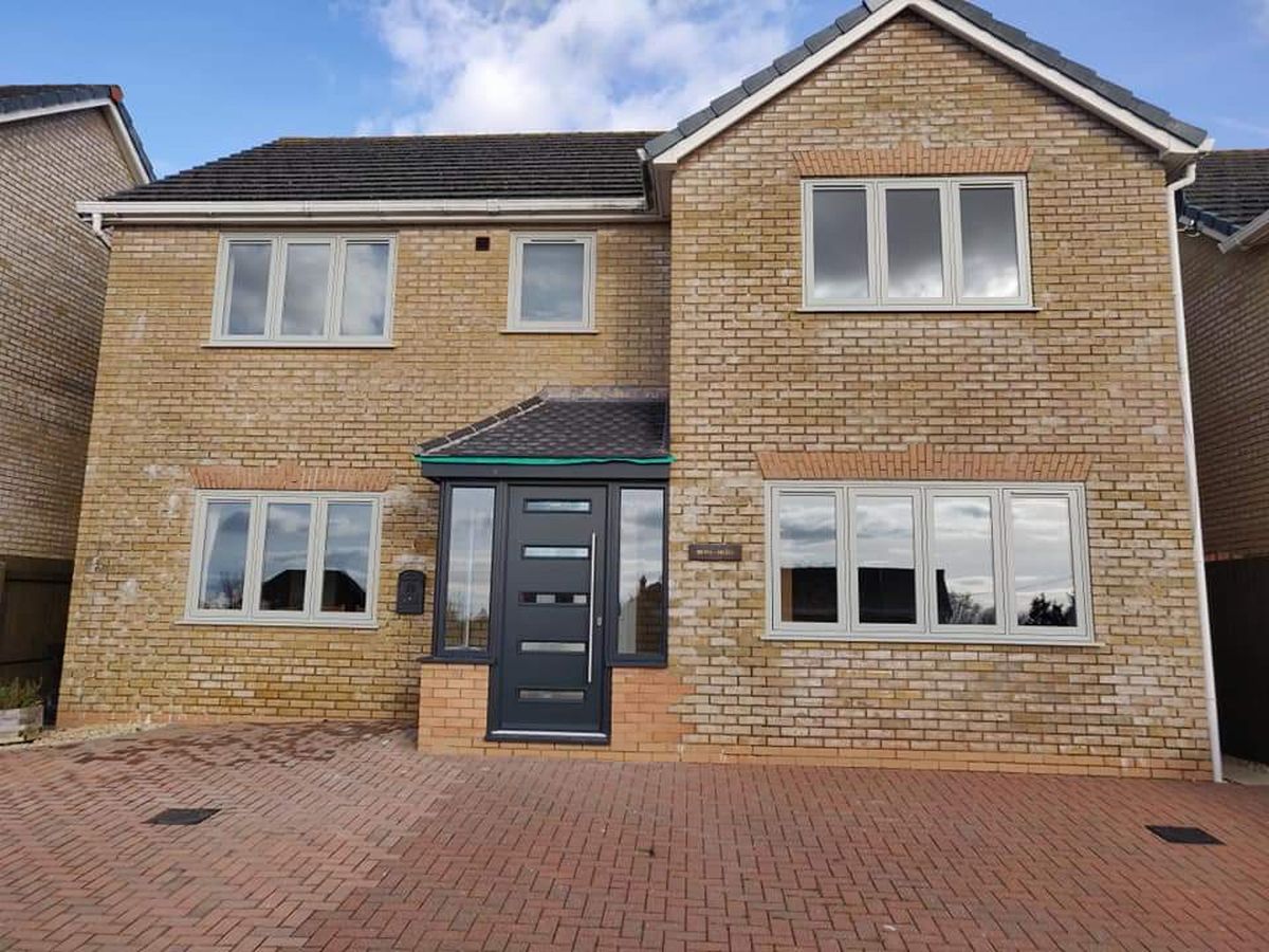 The same home before, with white frames